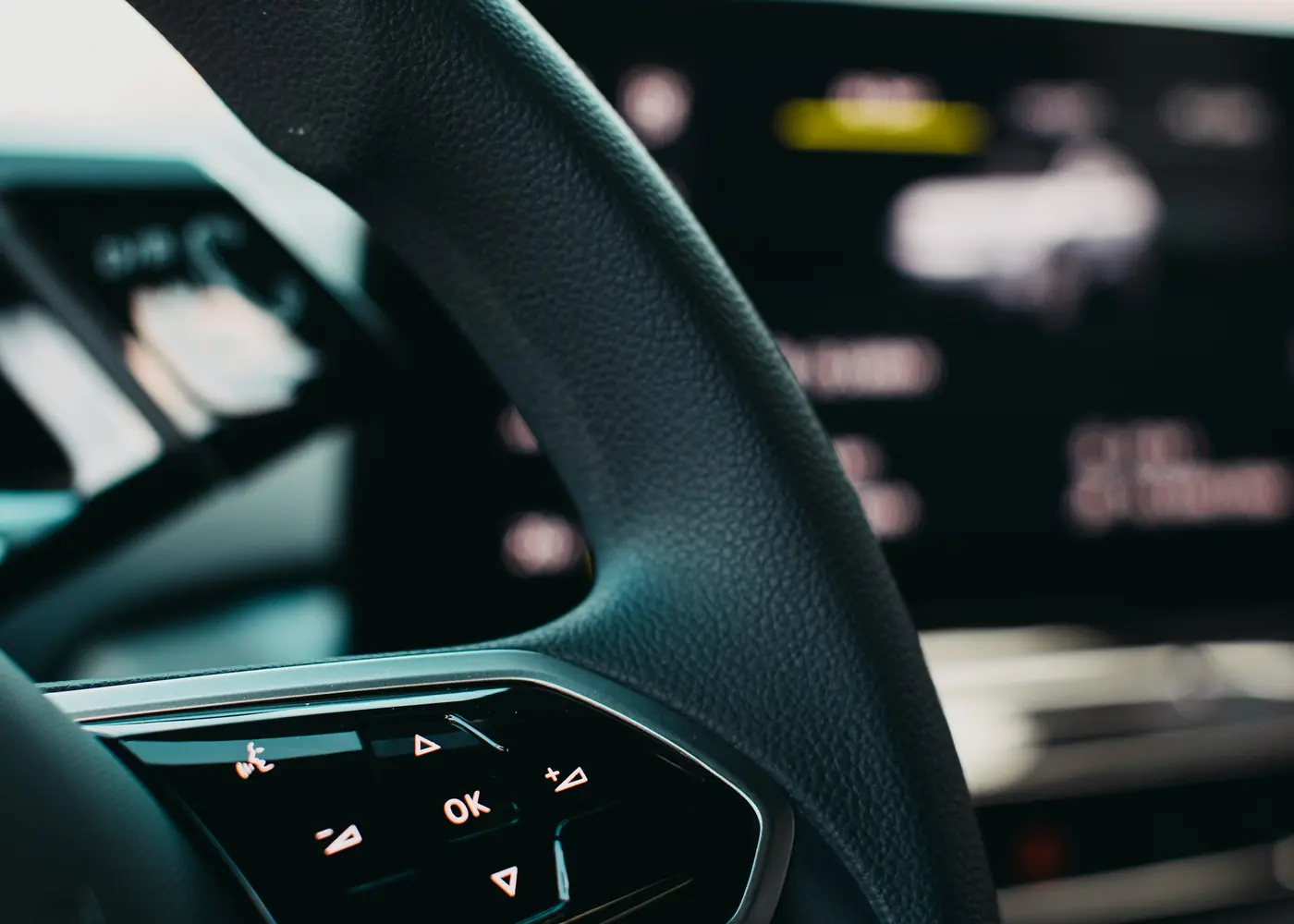 The steering wheel and dashboard display of an electric car